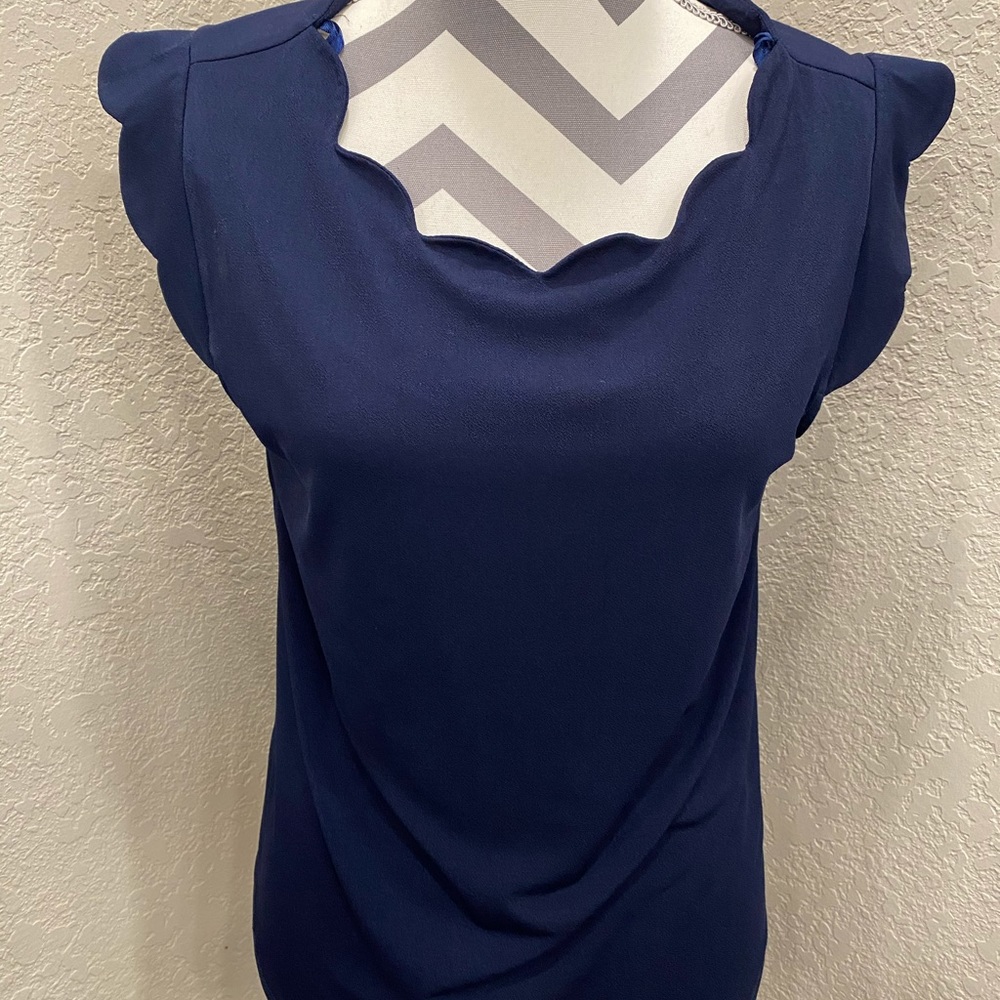 Monteau Scallop neck blouse.